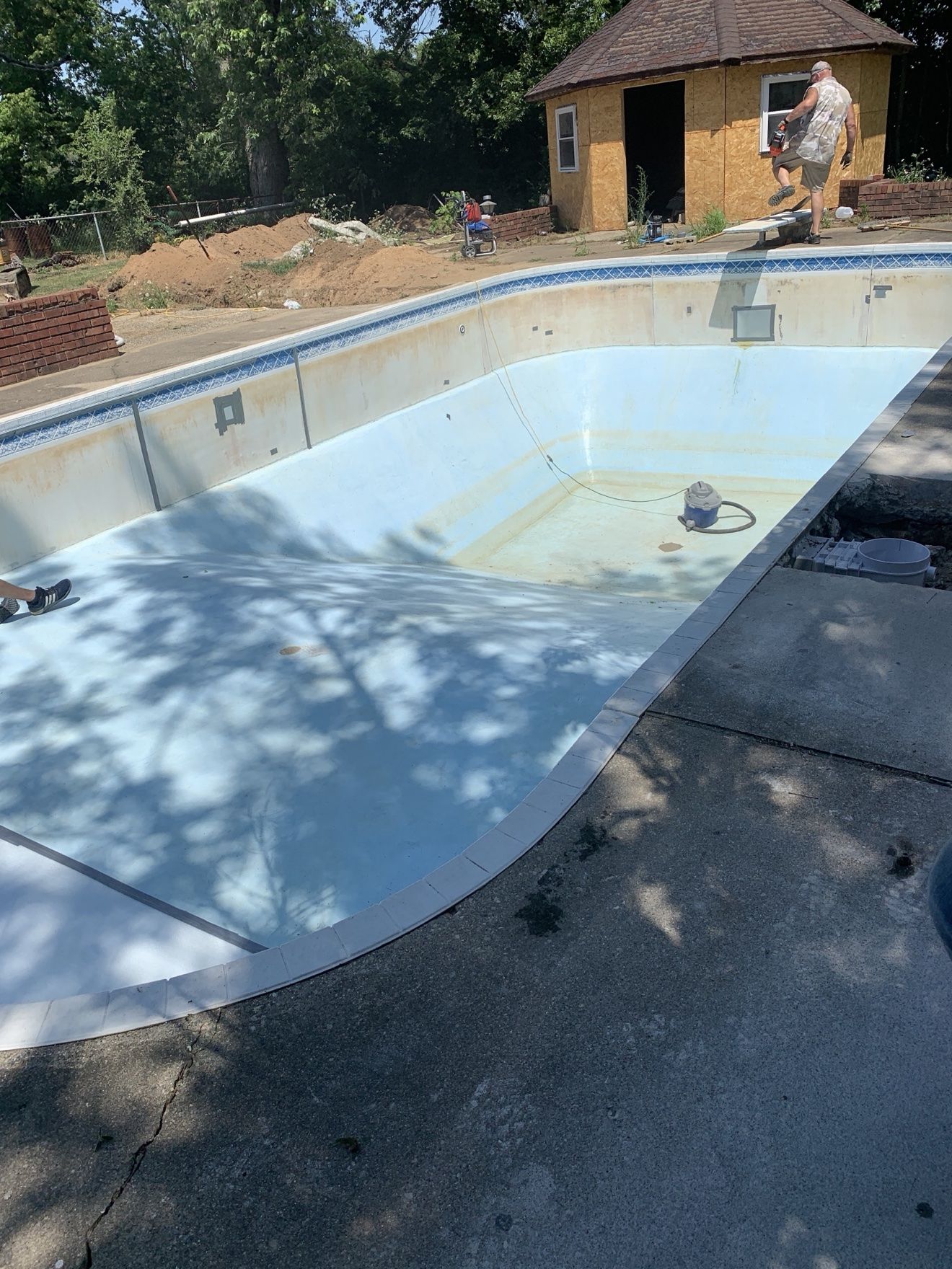 Same pool-house pool from another angle with the old liner removed and walls faded