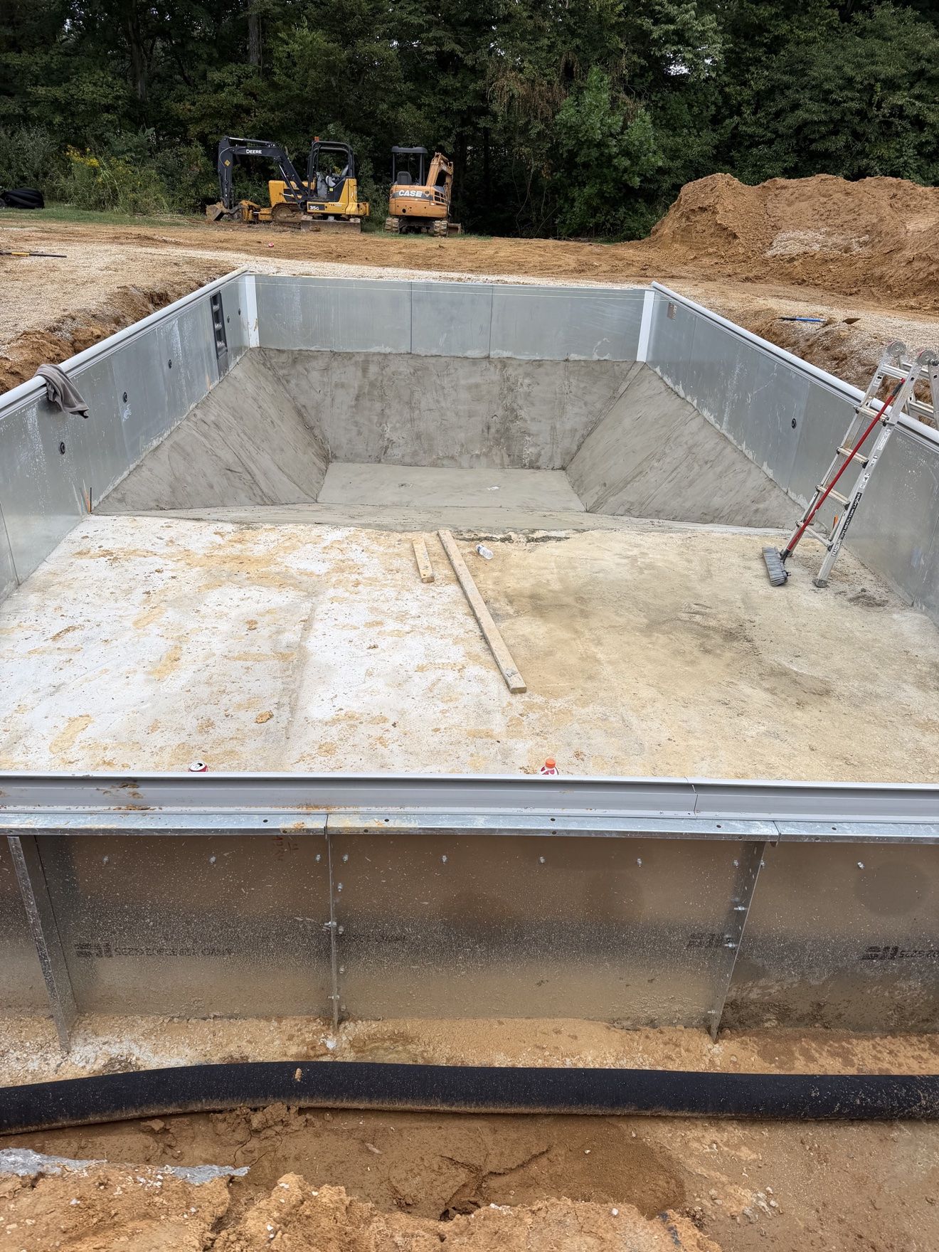 Finished concrete hopper floor of the inground pool before the liner goes in